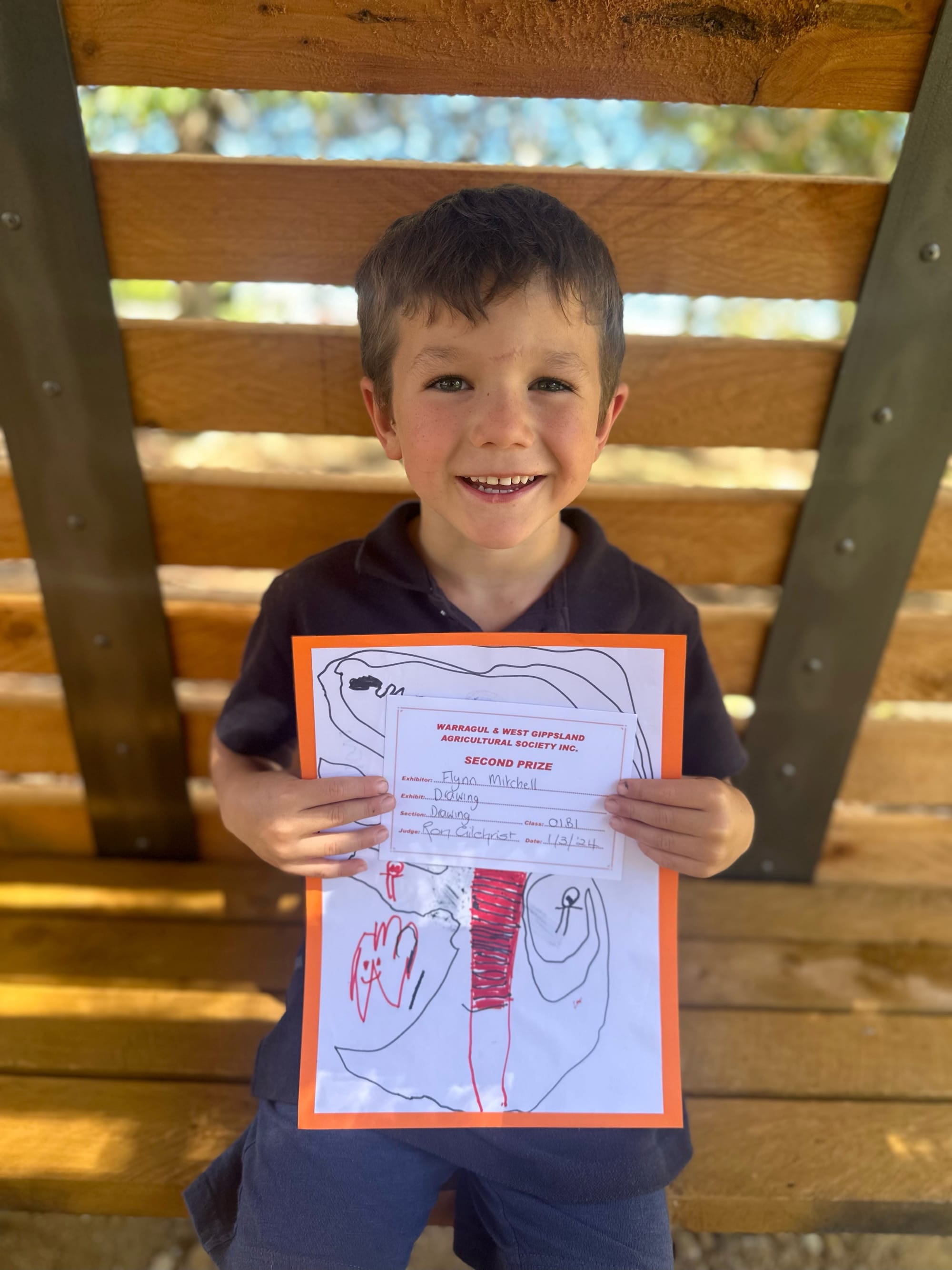 Prep student Flynn Mitchell with his second placed drawing.