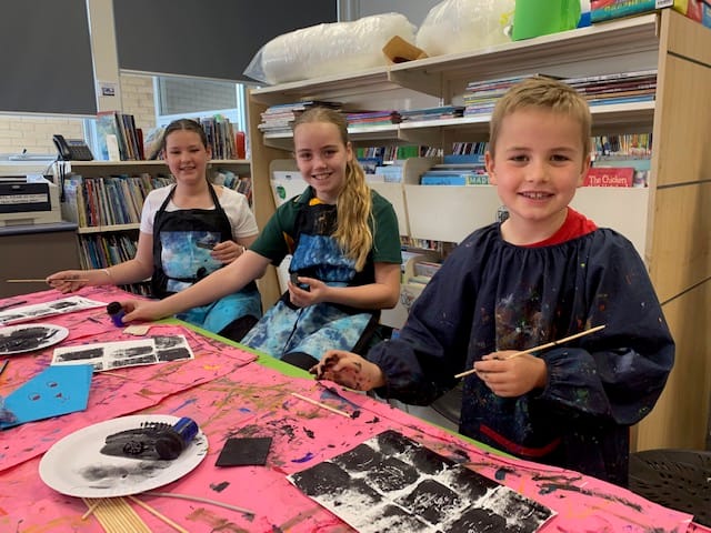 Students enjoying the printing (from left) Chloe Mynard, Ava Harvey and Sonny Harvey.