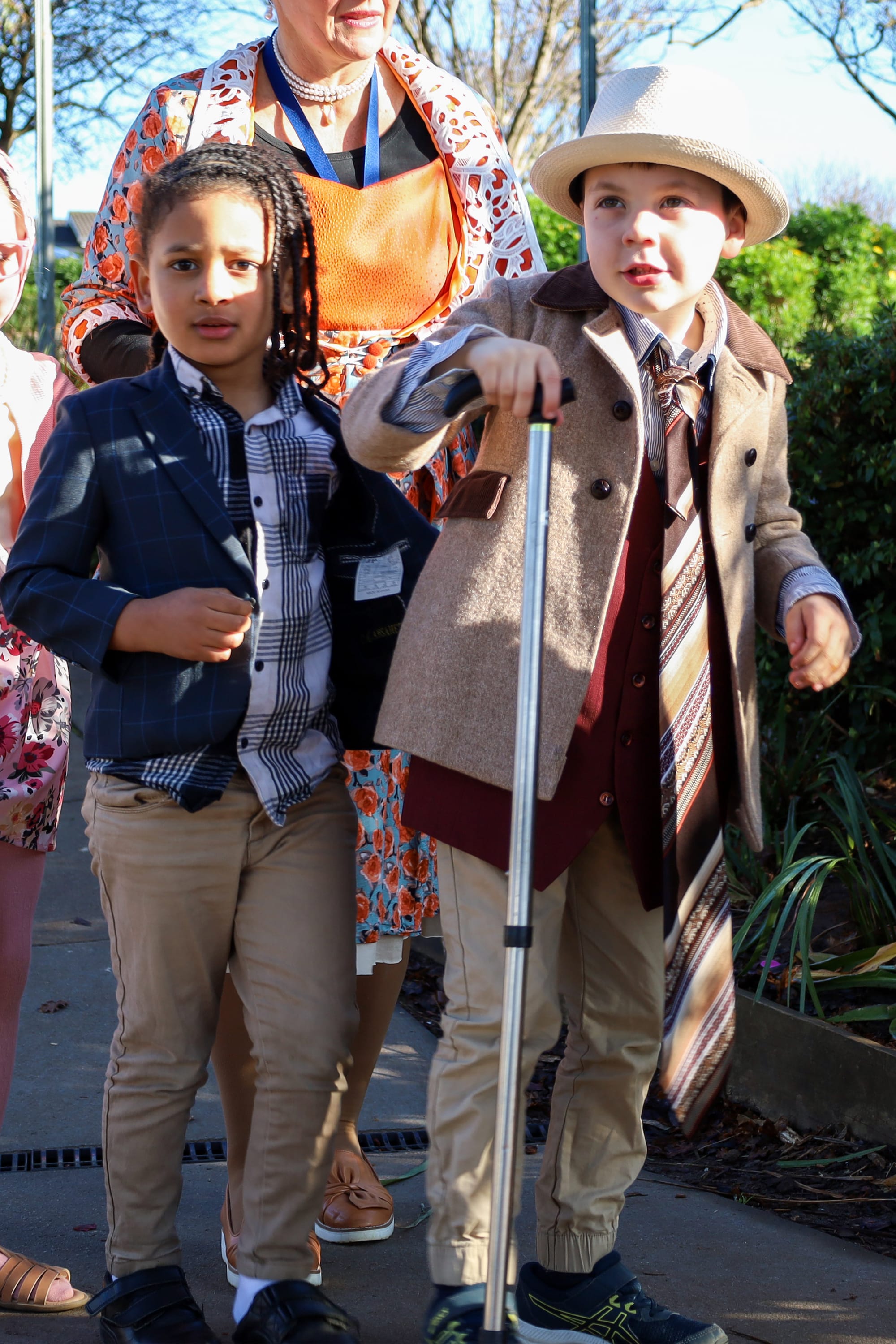 Marcel Musonda and William Bloomer on their way to tour classes for their special 100th day of school.