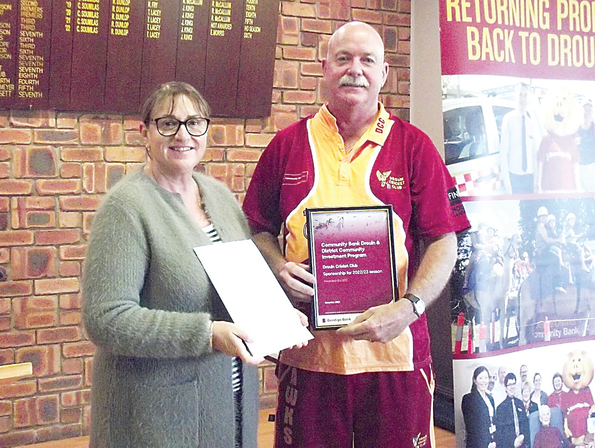 John Tomkins, representing Drouin Cricket Club, thanks bank director Vanessa Marsh for sponsorship of the club for the current season.