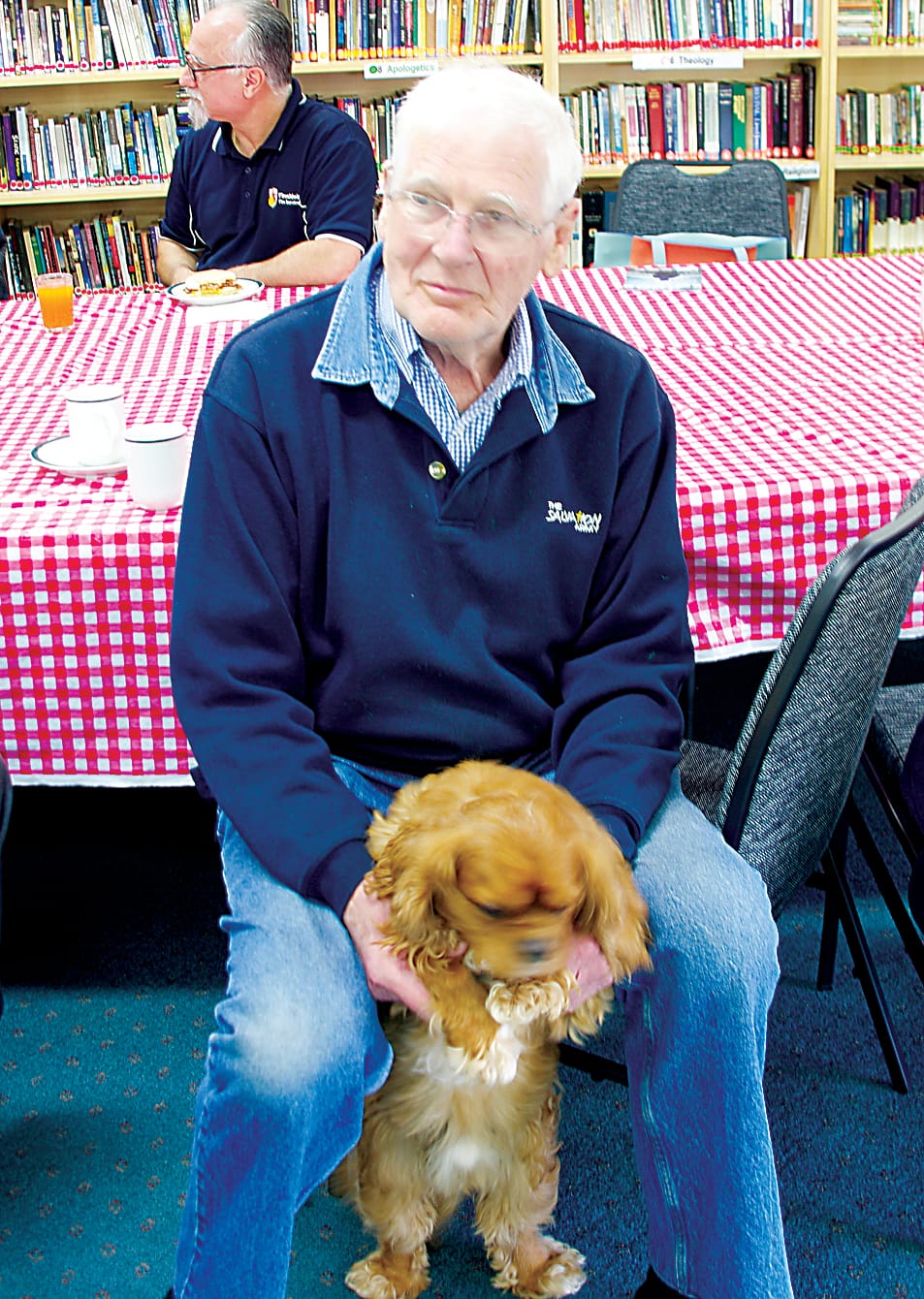 Andre Wierenga and Teddy the dog at the Salvation Army brunch.