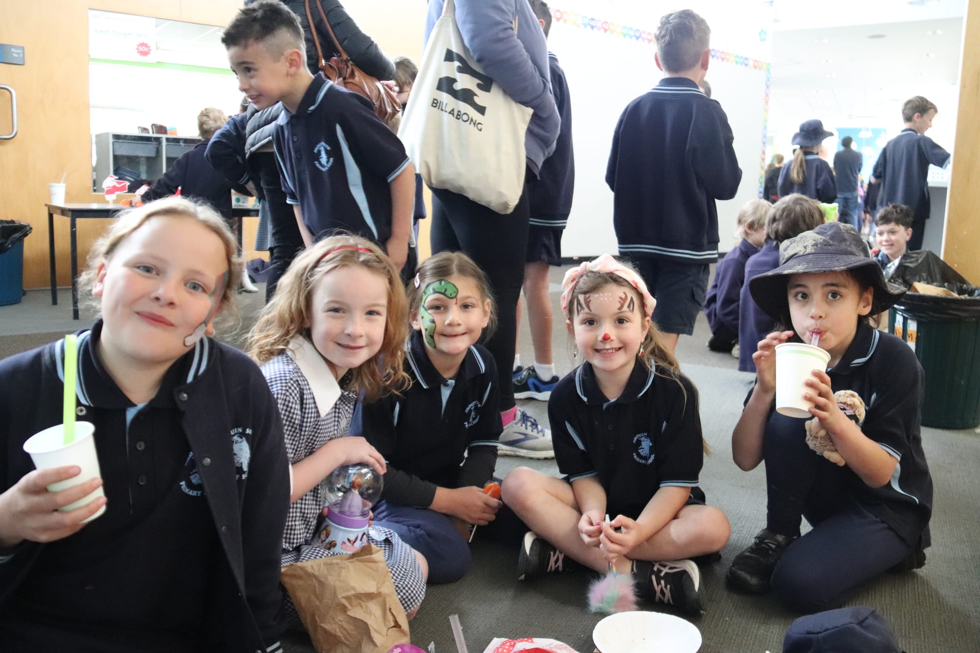 Josie, Tilly, Sophia, Chelsea and Tia all enjoy some sweet treats during the Christmas Carnival.
