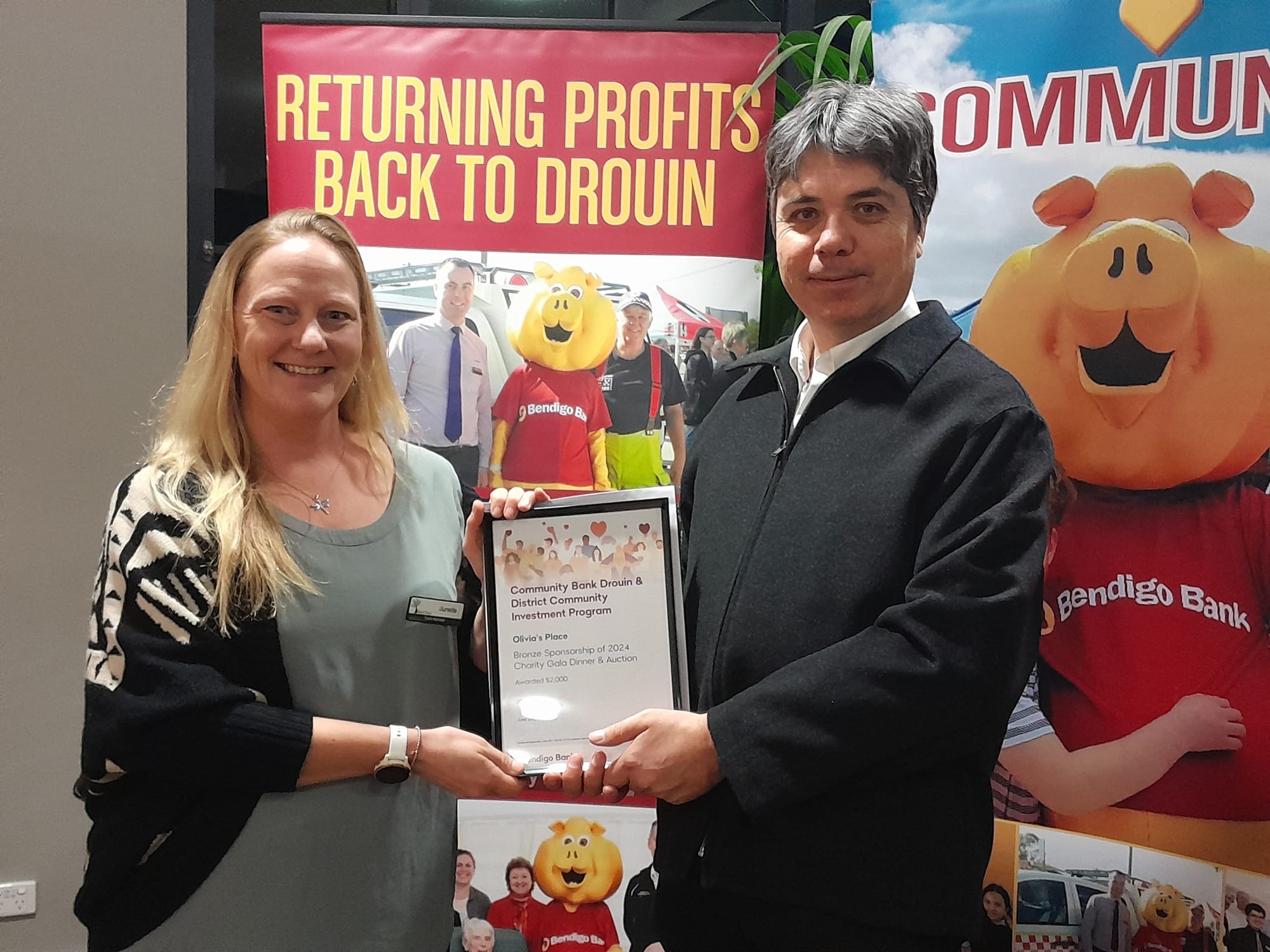Junelle Wilson of Olivia's Place with customer relationship manager Bruce Sorrell.