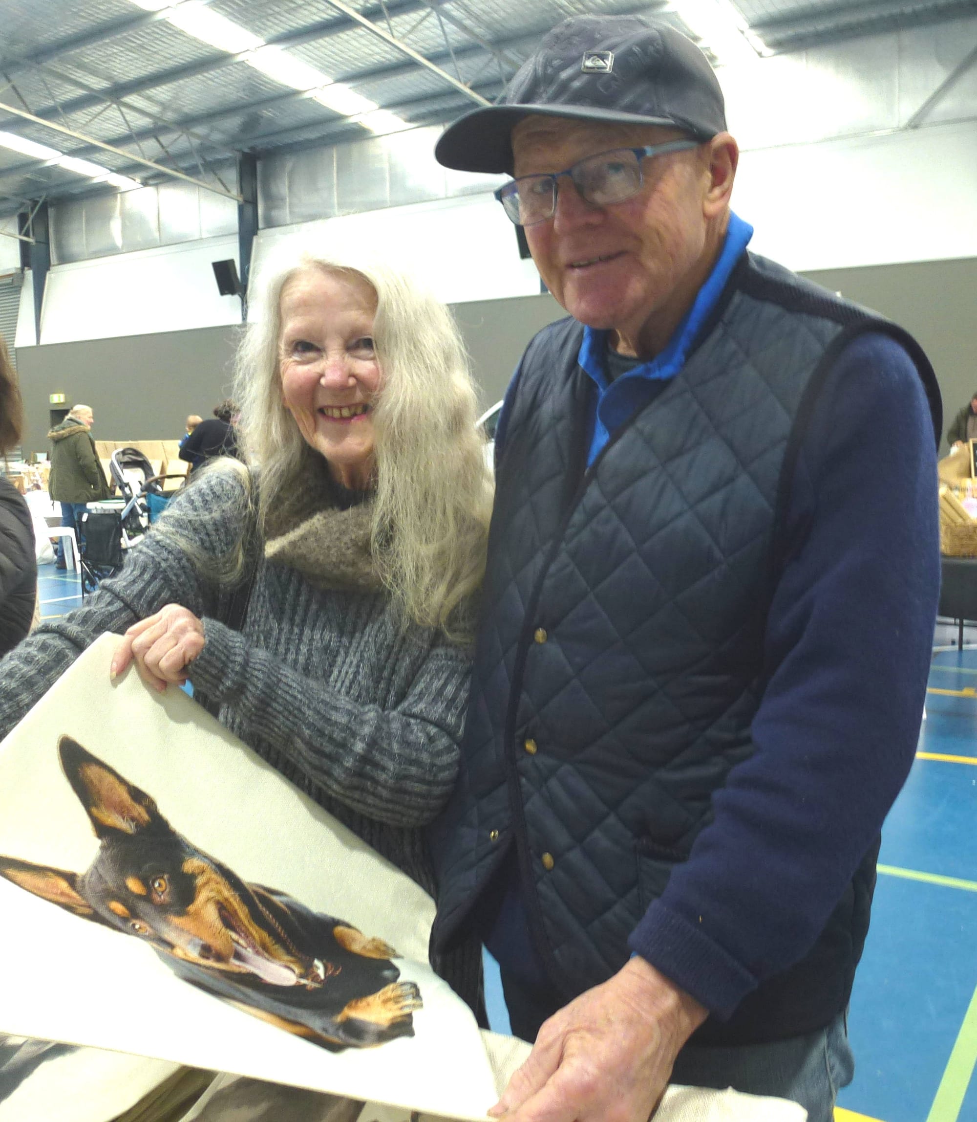 Margaret and Noel Beattie of Tynong North admire the portrait of a German Shepherd.