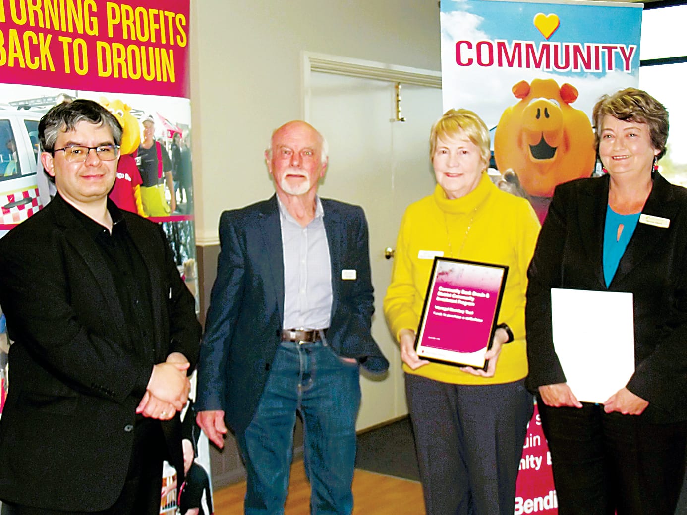 Drouin community bank director Rob Celada (left) presents towards the cost of a debfibrillator at Gulwarra Heights Cemetery at Warragul to cemetery trust members (from left) Ken Ipsen, Marie-Therese Luck and Meren Perry.