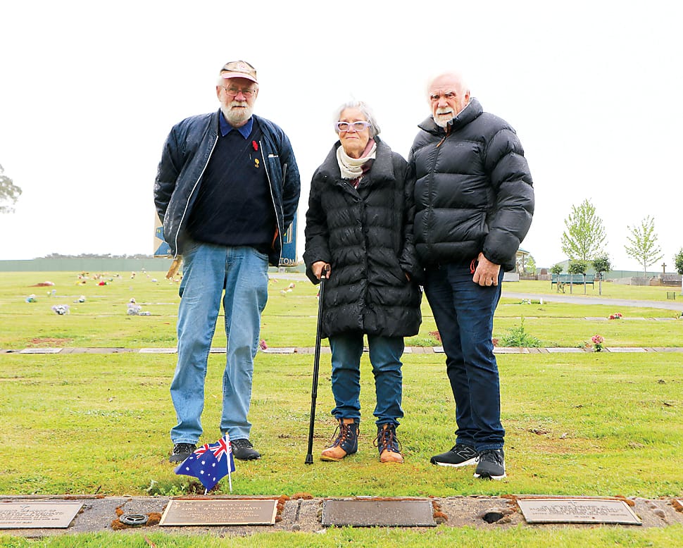 John Moys, Rhonda and Ian Jennings at the Neerim cemetery last week where Australian flags were placed on the graves of returned service men and women.