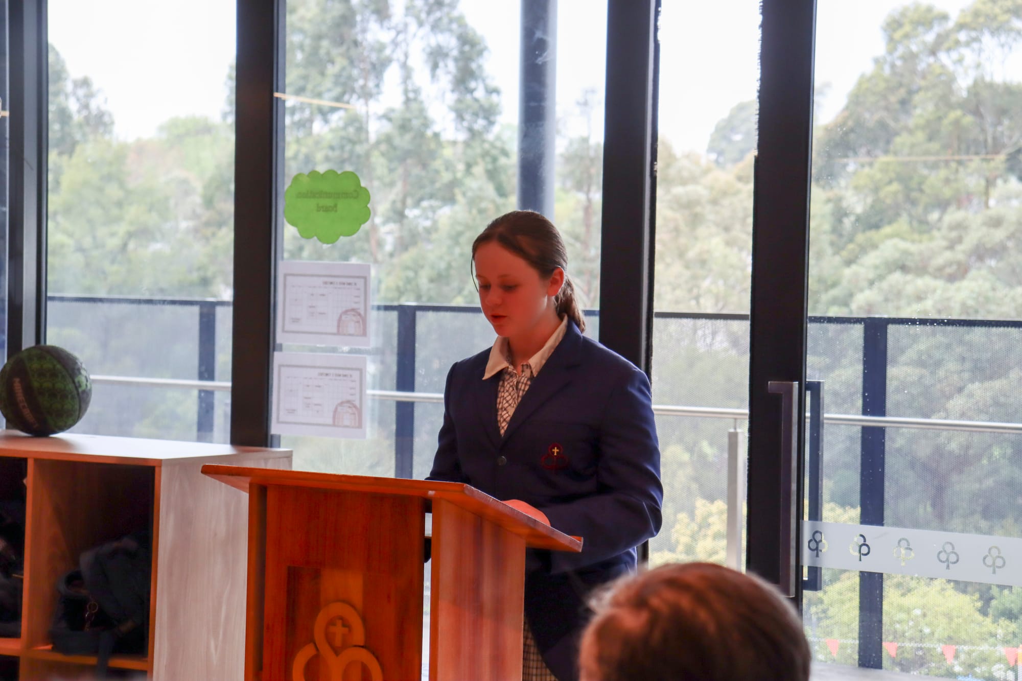 Junior school captain Eve Sterling gives a bible reading.