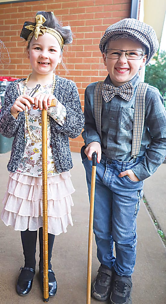 Sporting rollers and walking sticks are 100-year-olds Posie Creighton and Thomas Dickinson.