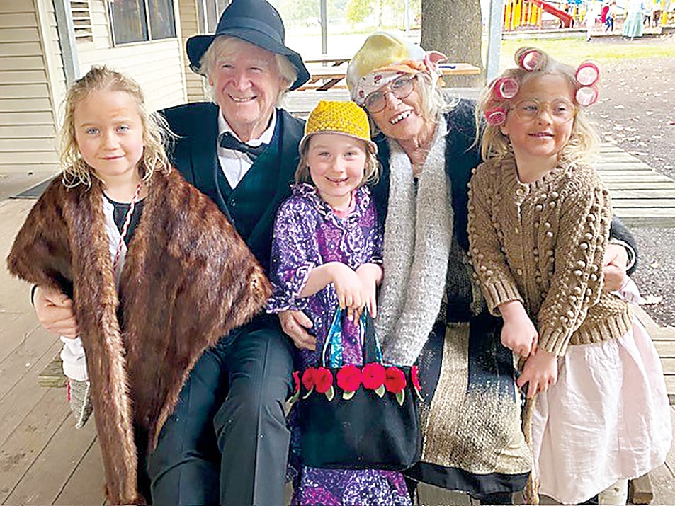 Pearl, Matilda and Florence Purton (front) enjoyed bringing along their grandparents to celebrate 100 days of learning.