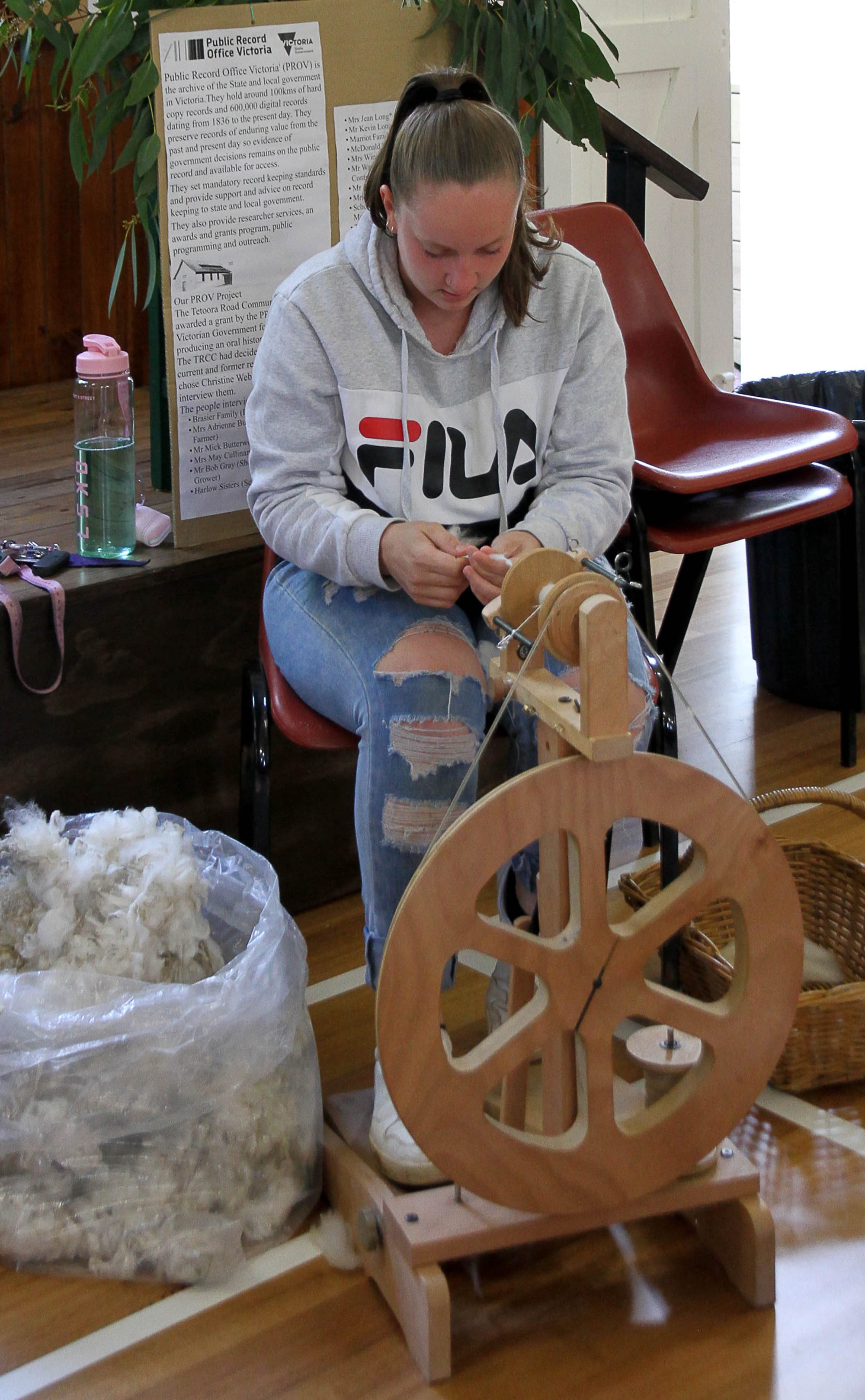Skye McDonald from Warragul demonstating wool spinning
