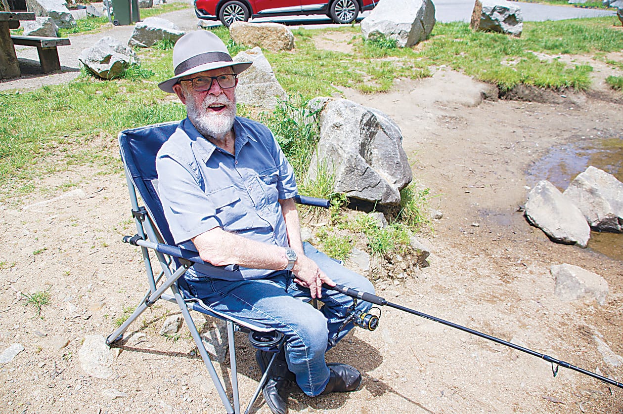 Bill McMahon is all smiles as he casts a line.