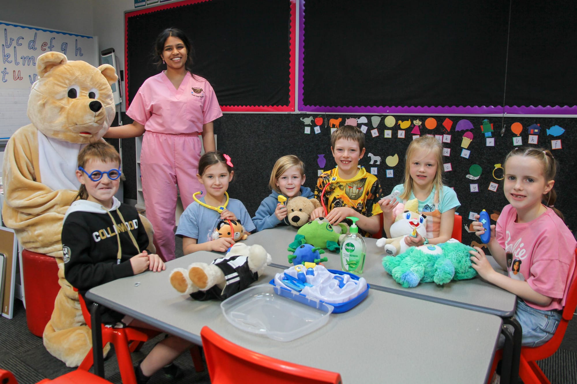 Monash Teddy Bear Hospital volunteers, Big Ted and Natania D'Sa, with Darnum Primary School students and their teddy bear friends (L-R)  Donny Martin, Tahlia Trenerry, George Hunt, Reuben Mohr, Isla Mumford and Tess Munro.