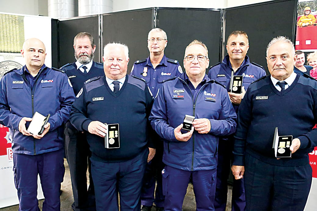 There was a large contingent of Neerim South members who were honoured to collect their medals at the Lardner Park ceremony ( back, from left) Terry McPhee, Wayne Kerrigan and Nigel Cristifaro, (front) Julian Van Raalte, Alan Richardson, Captain Brian Barwick and Wayne Kerrigan. Absent: Stephen Anderson, Zoe Barwick, Ian Mackay.