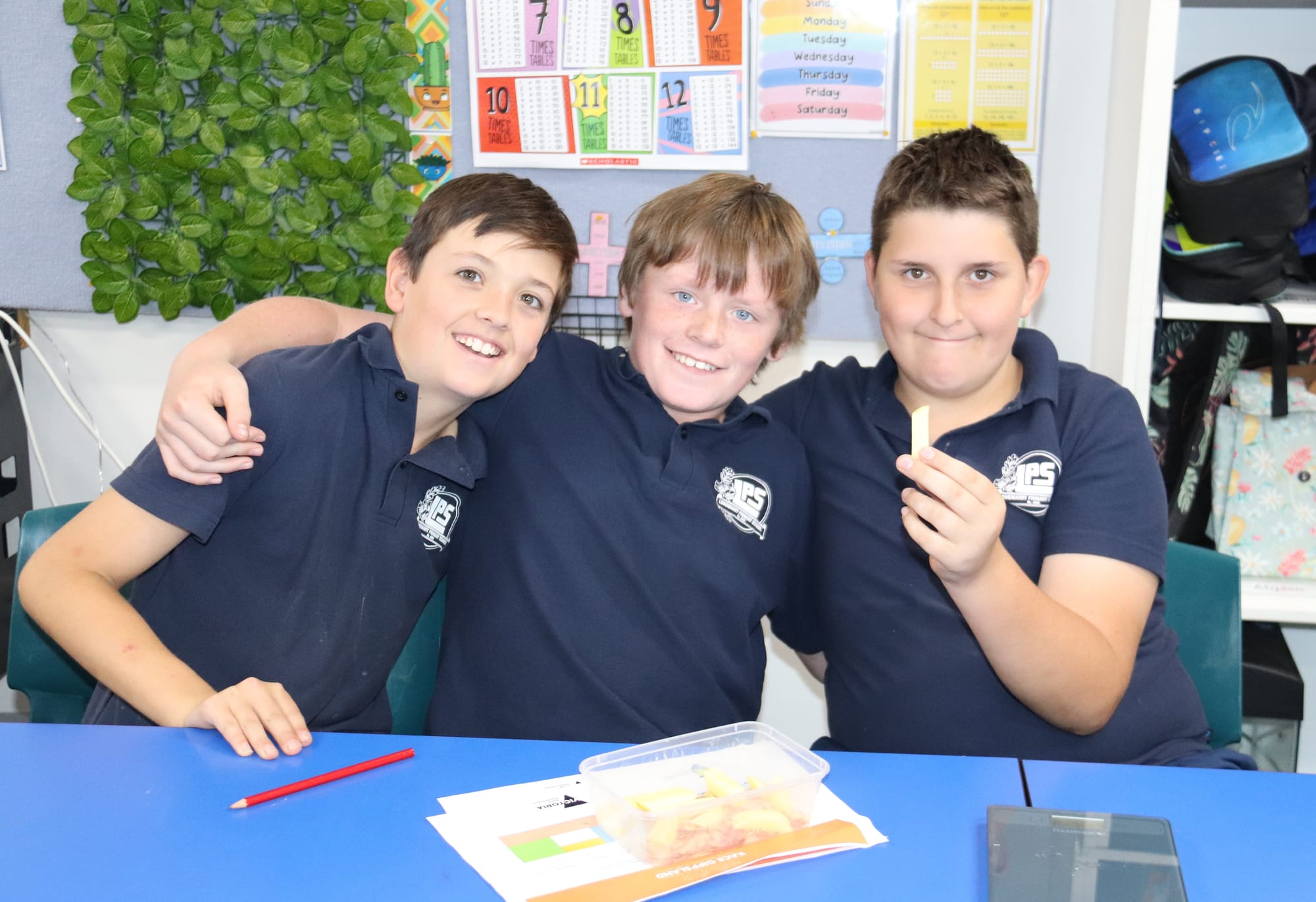 Proudly showing off their fries are Aiden, Austin and Alexzander.