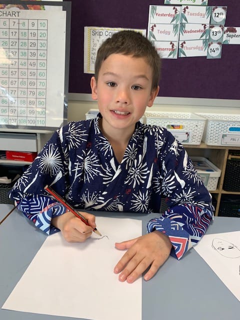 Conrad Edwards does some drawing on the Japanese day.