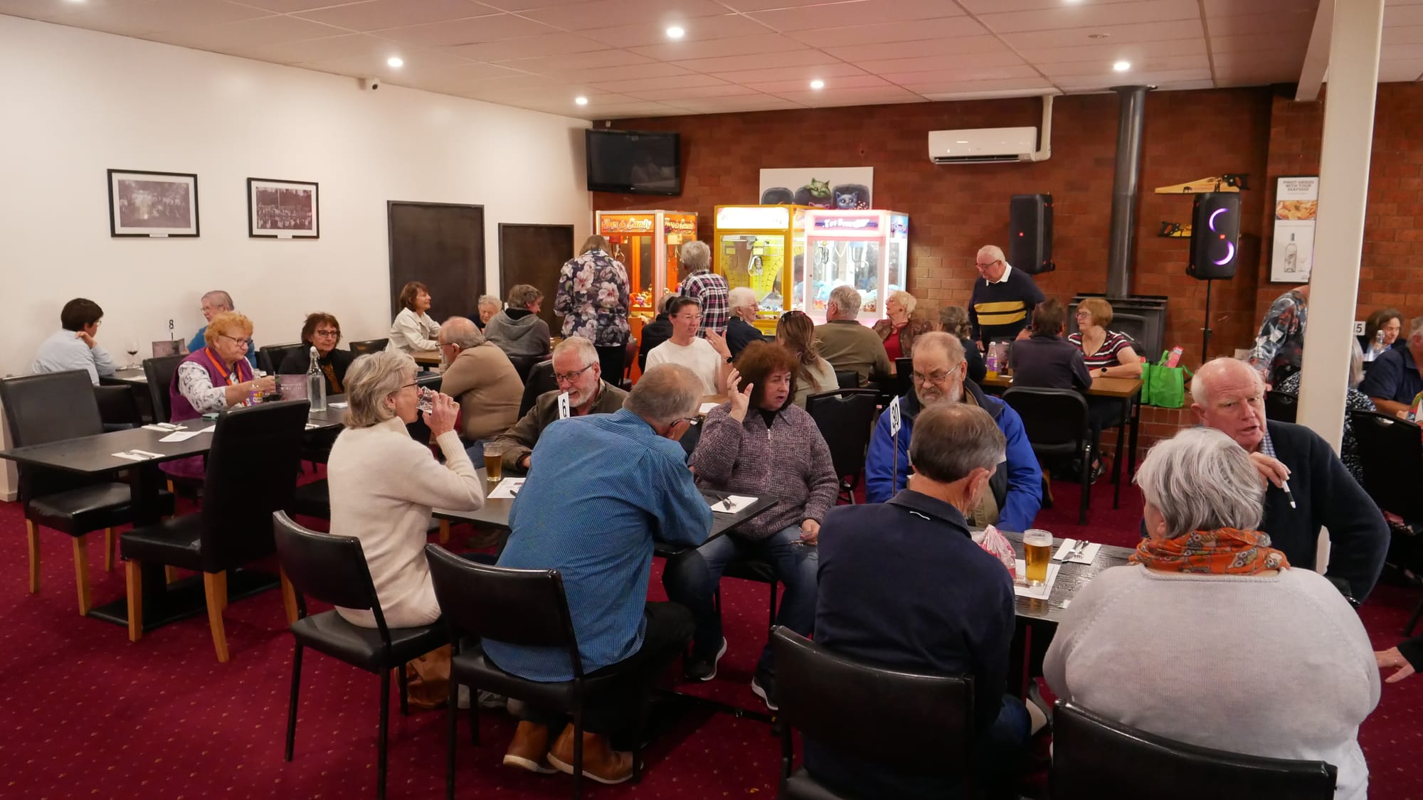 Mirboo North locals tuck into a free lunch at the town's hotel provided by Drouin Men's Shed to recognise their ongoing recovery from the effects of a severe storm that ripped through the area in mid-February.