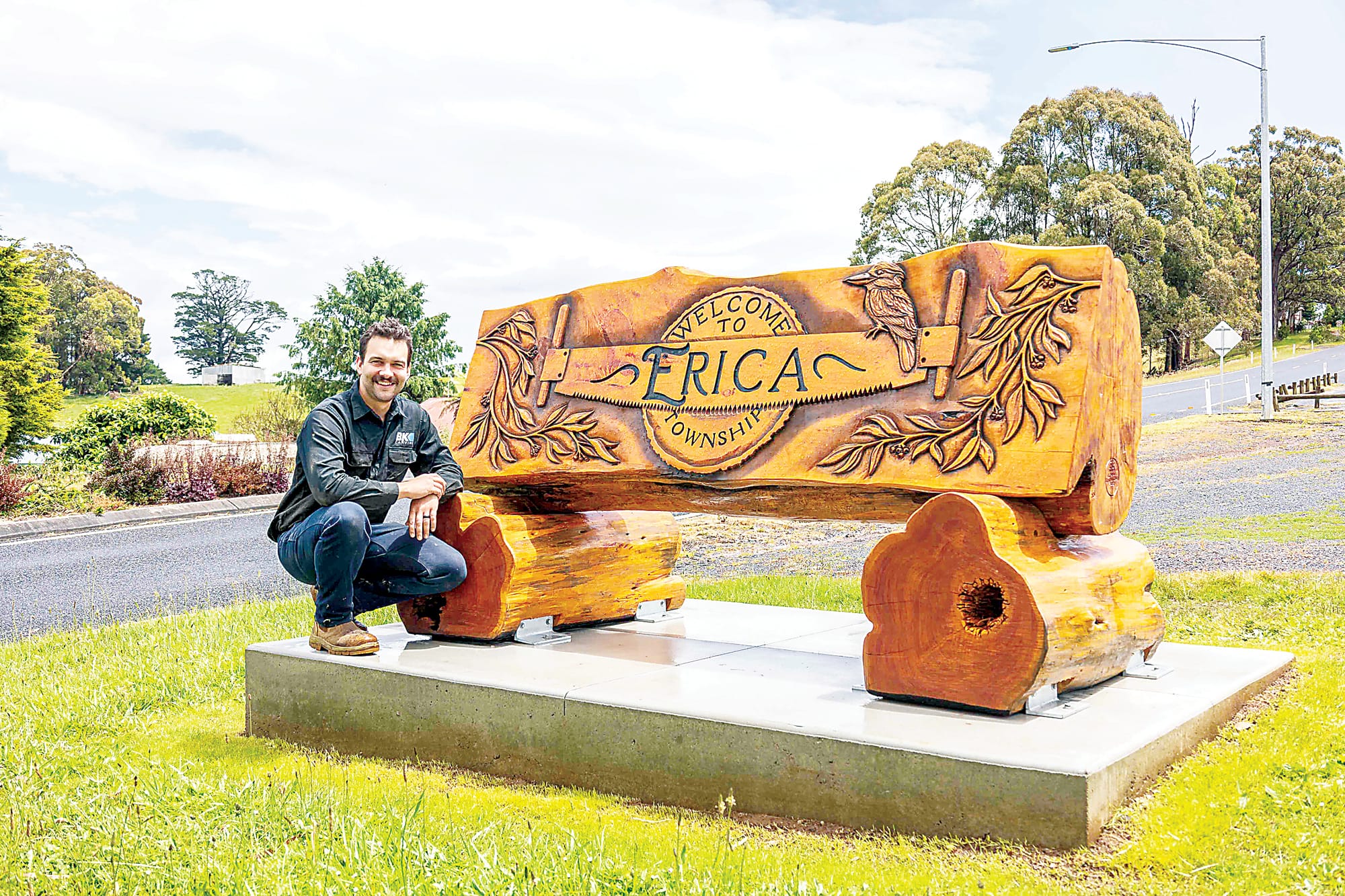 Left: Brandon Kroon with the finished carving in Erica.Below: Drouin local Brandon Kroon hard at work in his workshop.