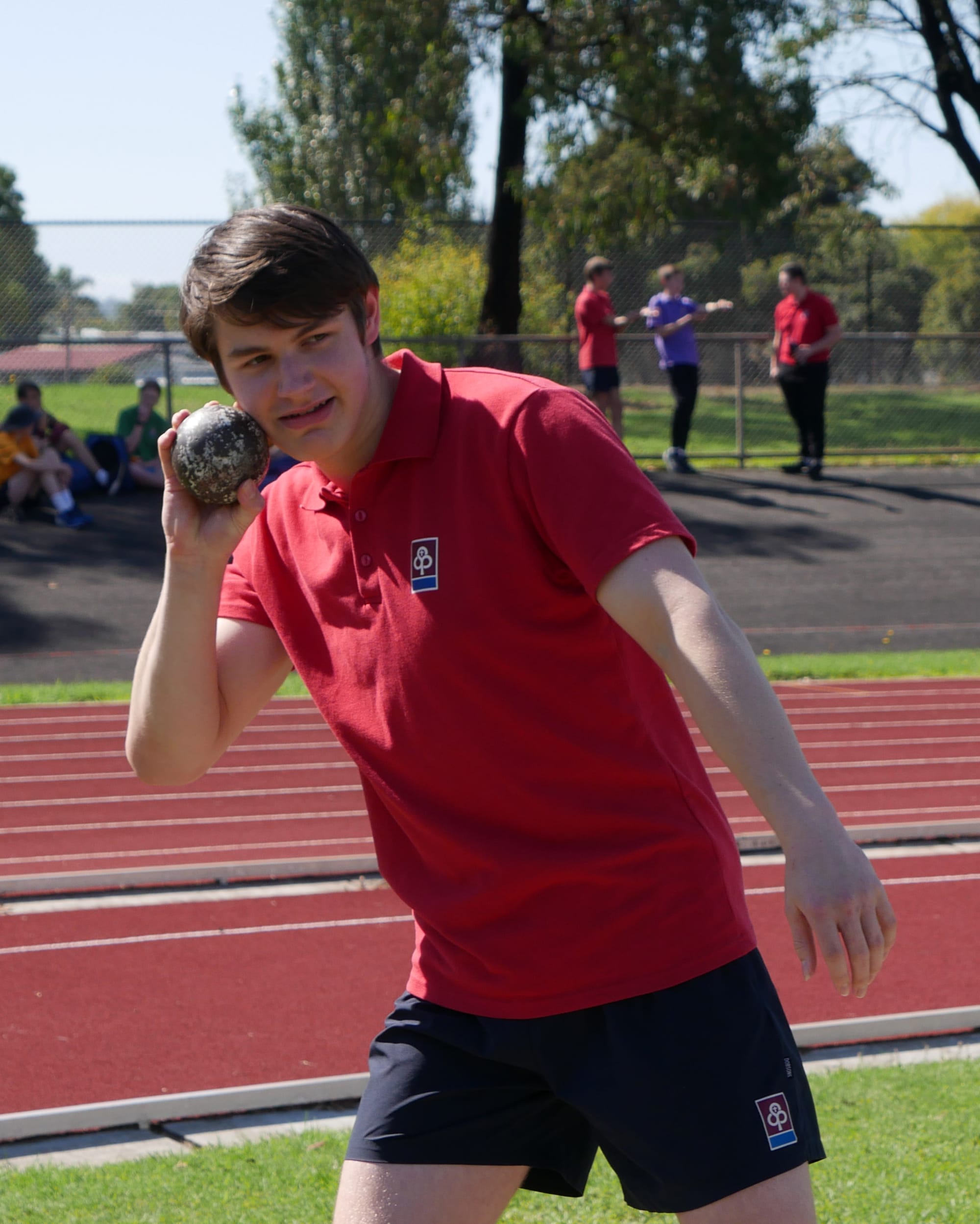 Year 10 student Dylan Hollier prepares for the shot put.