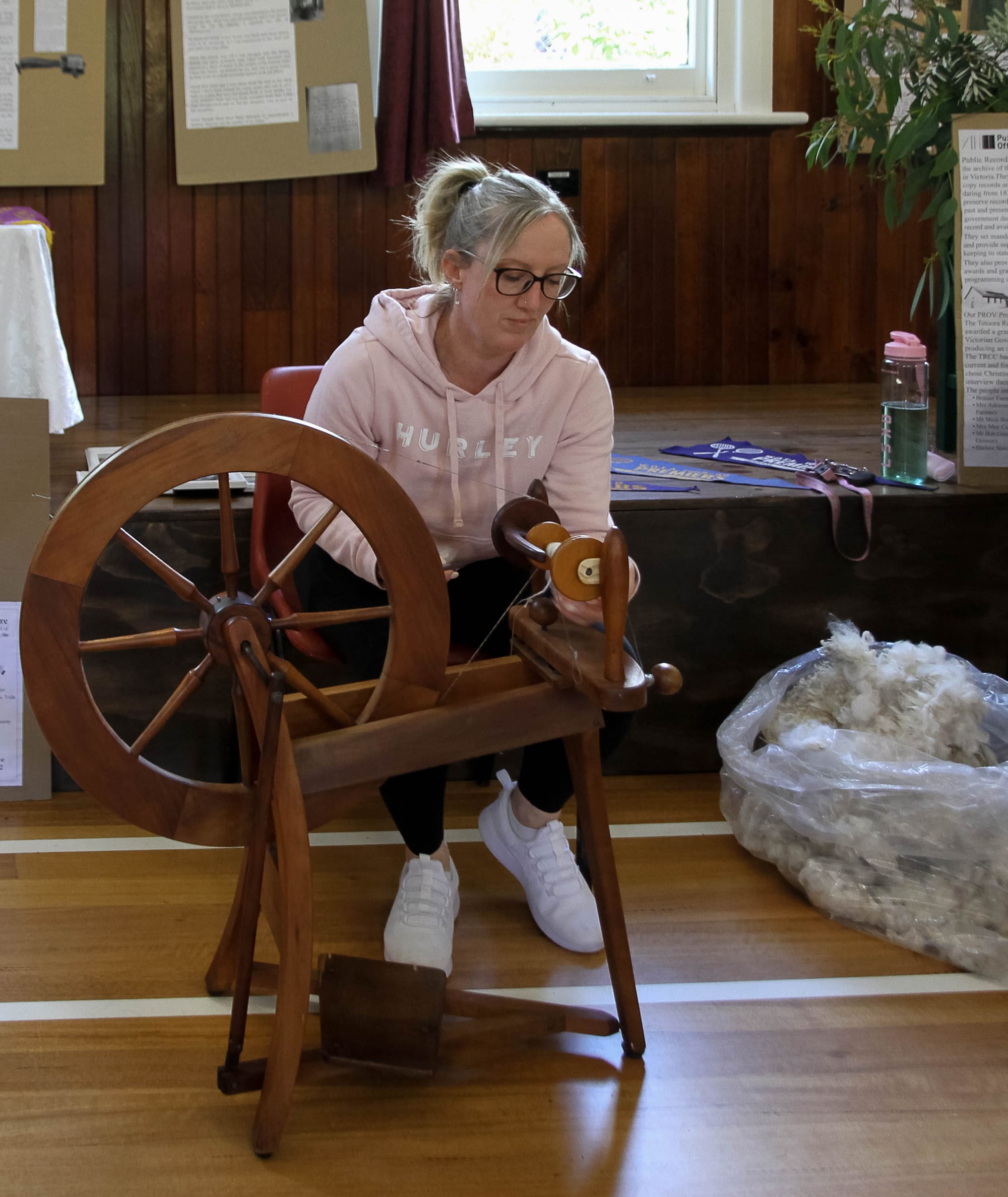 Rebecca McDonald from Warragul demonstrating wool spinning