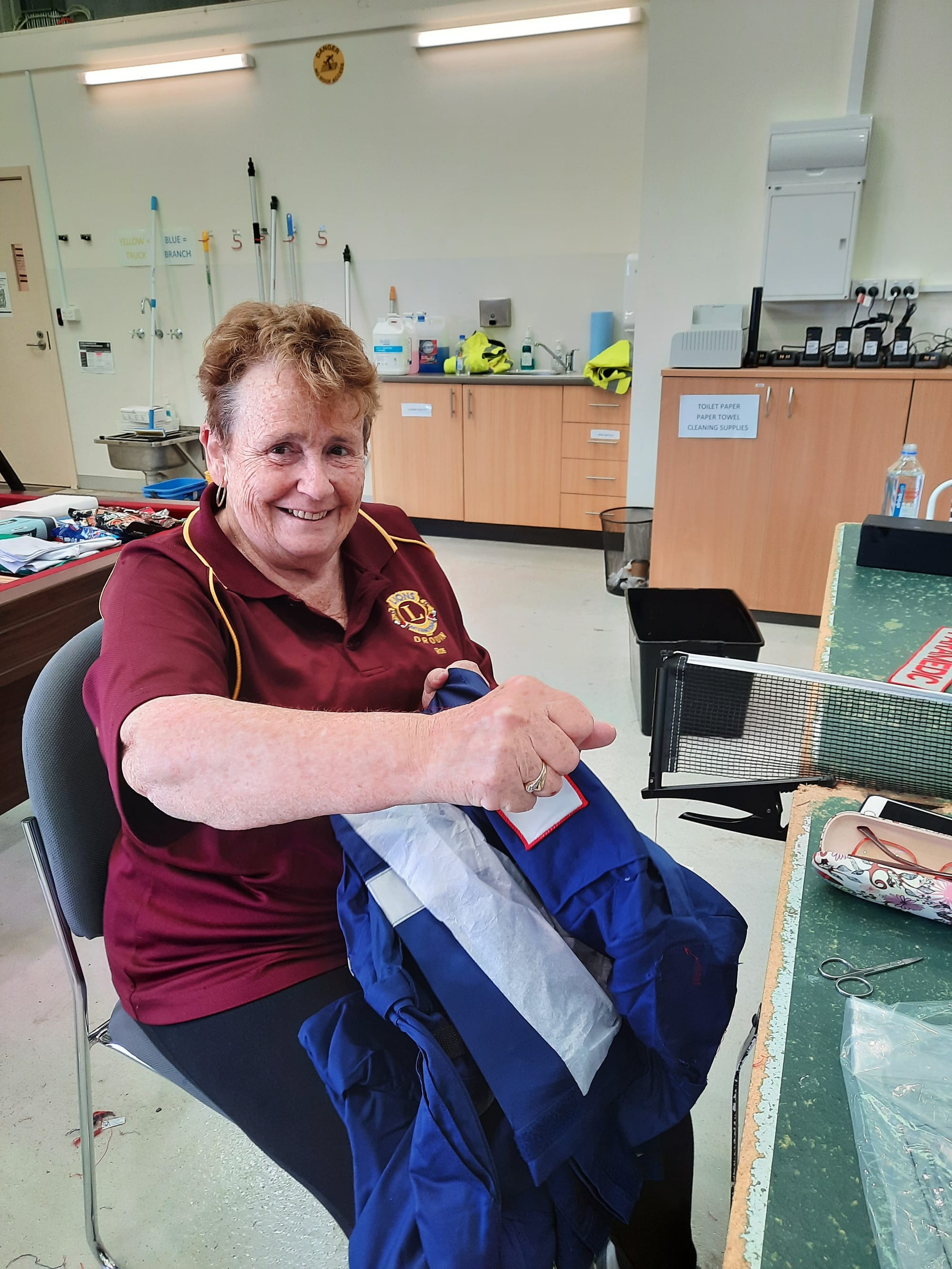 Drouin Lions Club member Roslyn Ough was kept busy de-badging uniforms.