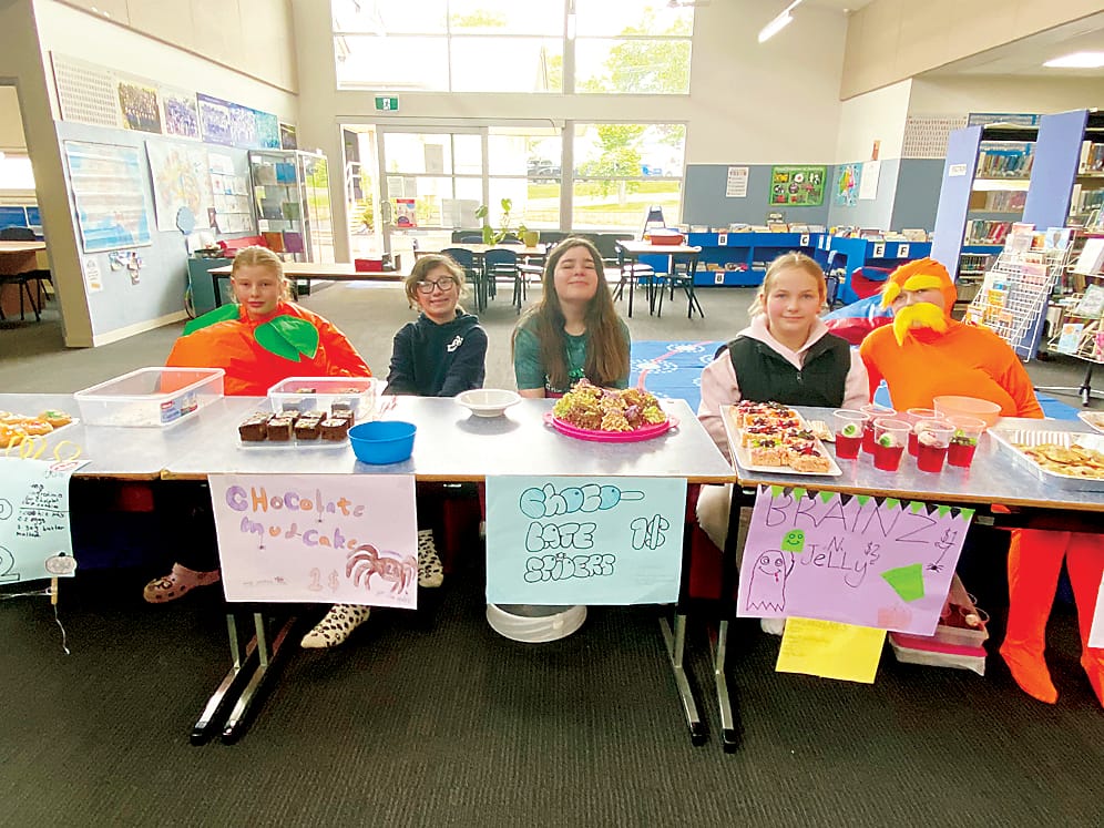Ready to sell their spooky treats are Neerim South Primary School students Chloe, Hayley-Jade, Freddie, Penny and Izzy.
