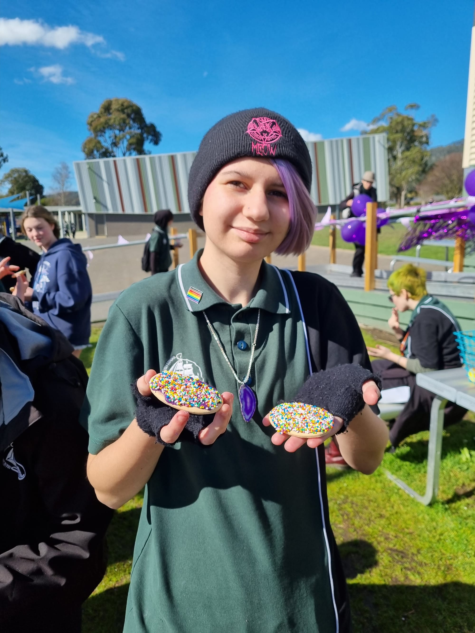 Year 11 student Nadia Davies shows off some of her purple decorated biscuits.