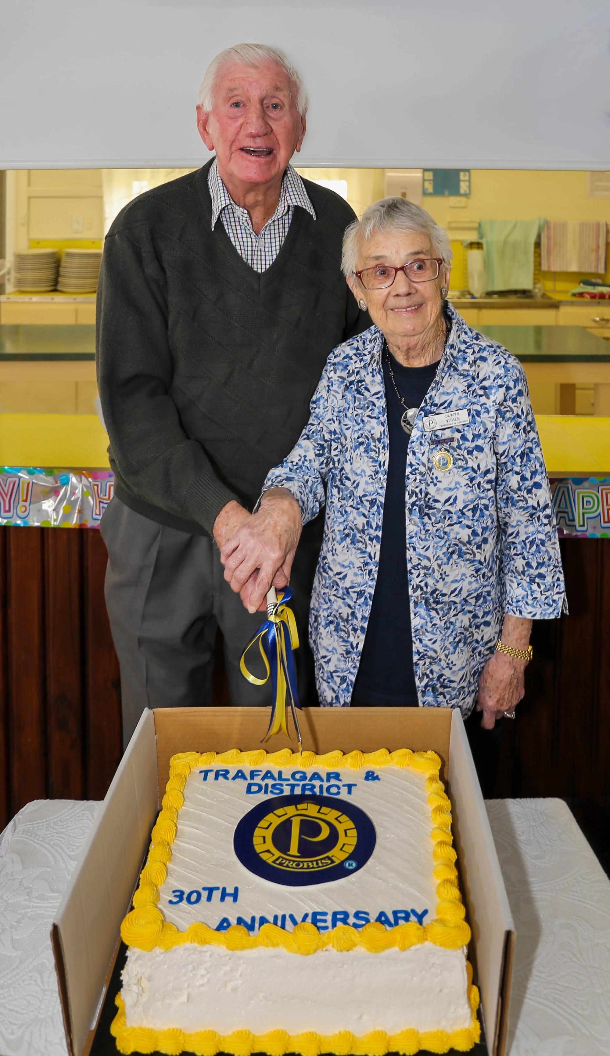 Peter Farmer and Olwyn Vitale cut a cake celebrating the 30th anniversary of Trafalgar and District Probus.