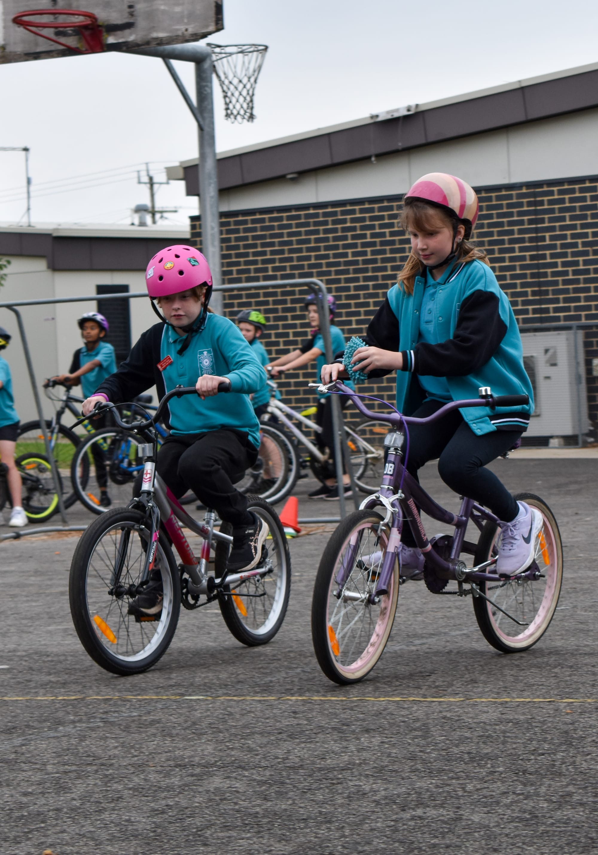 Maleah Desira and Scarlett Lancaster enjoy learning about bike safety.