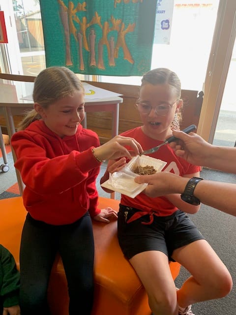 Zara Boyle (left) and Jaylah Shields sampling the Japanese omelette.