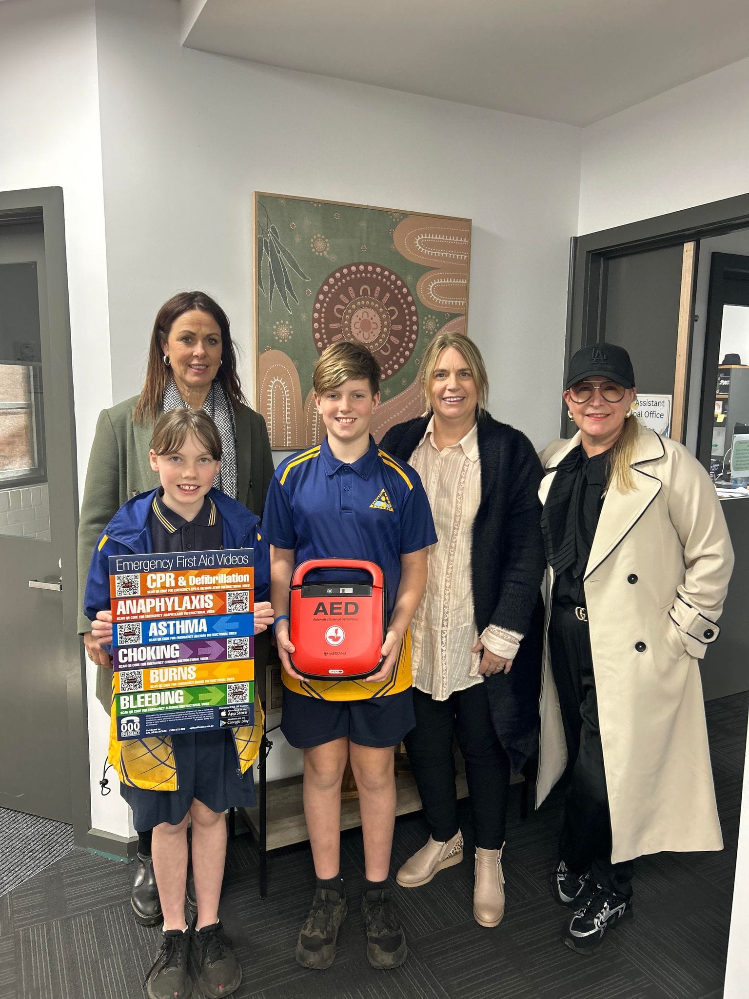 Margie Whitford, Charlytte, Madison, Olivia, Rudy, Tyson, Alfie and principal Michael  Smethurst at Poowong Consolidated School.