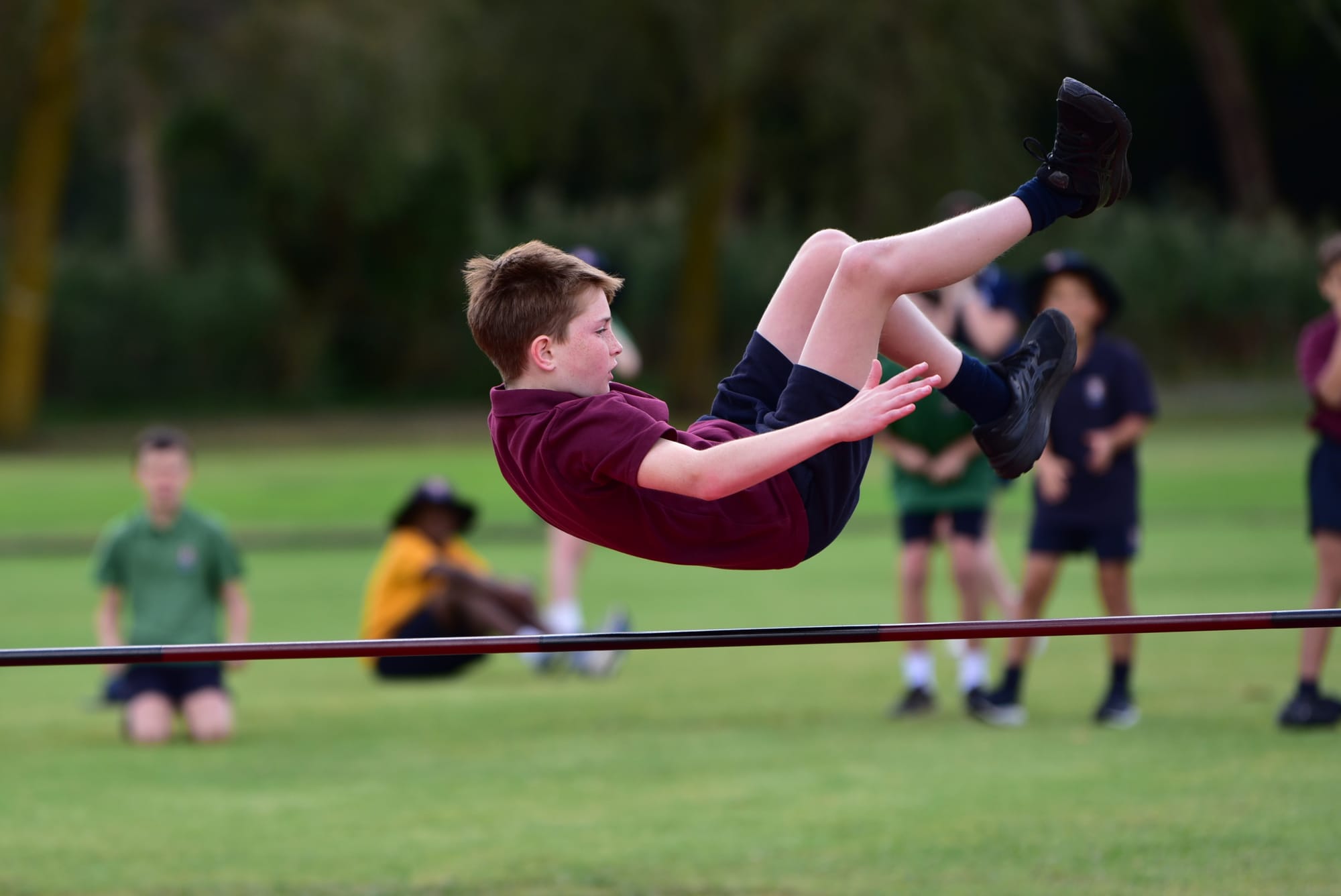 Setting the bar high in the high jump is Chase Gleeson.