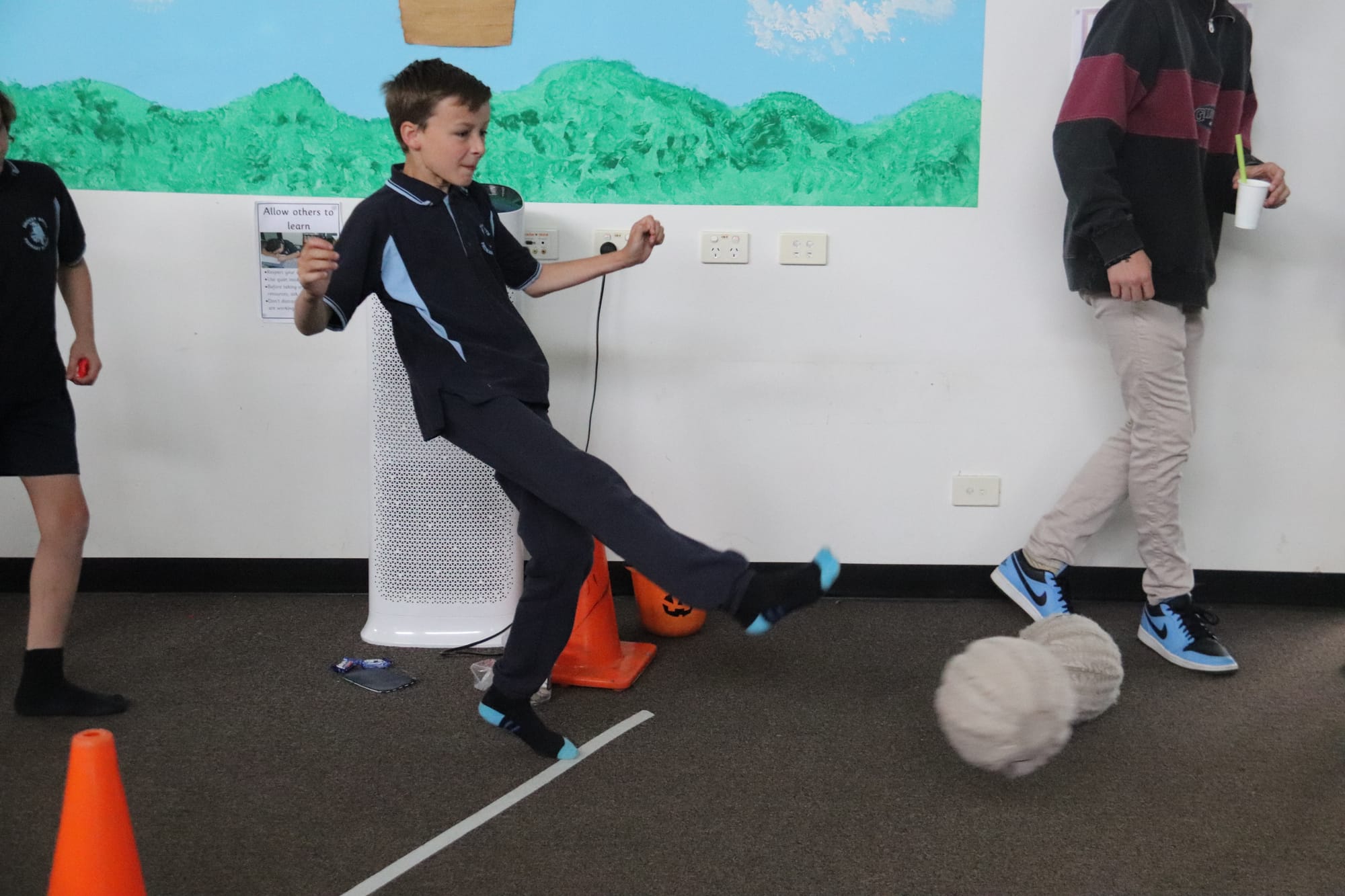 Showing some good follow-through as he kicks at the inflatable target is Nate.