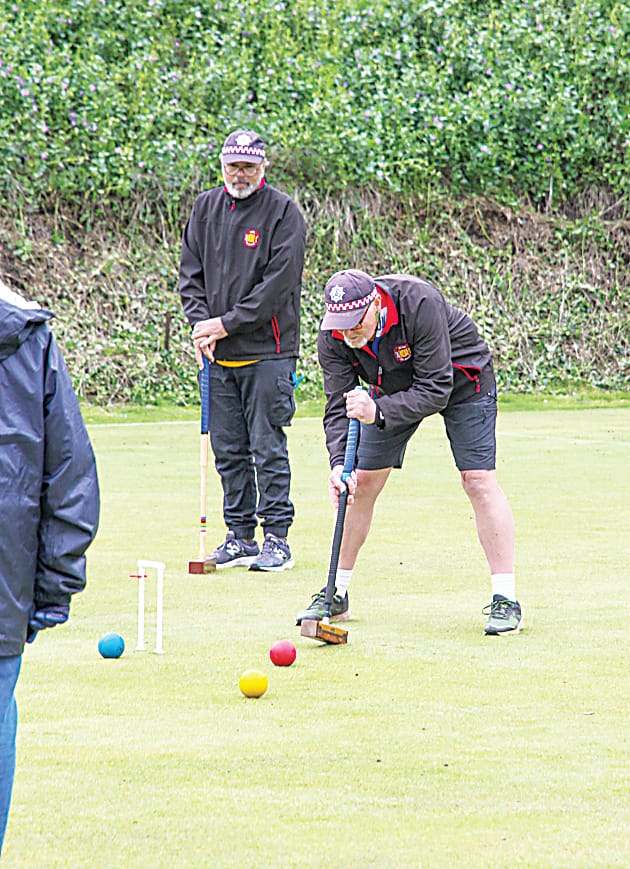 Drouin's Andrew Grant and Michael Crawford compete at the Warragul Croquet Club doubles tournament.