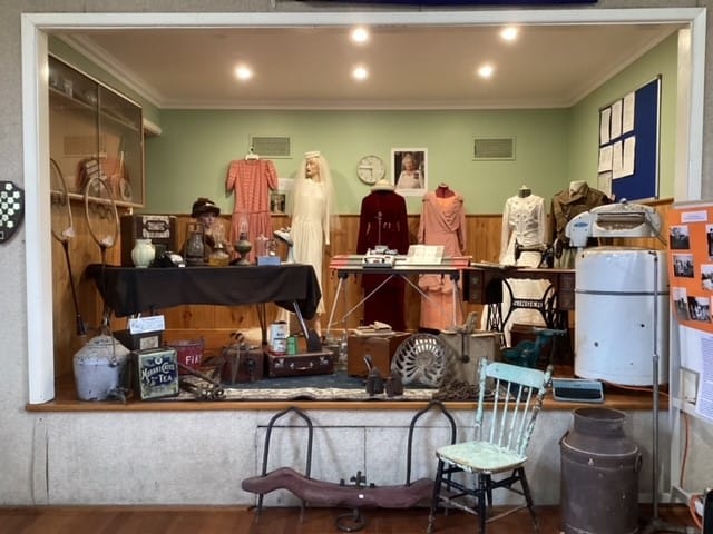 Above: The centenary committee at Athlone hall are (from left) Lyn Hatch, Cr Keith Cook, Leesa Williams, Daryl Smethurst, Jenny Smethurst, Gwenda Davies, Maurita Harris, Denise Cook and Leanne Miller.Right: Lyn Hatch makes a speech before cutting the centenary cake at Athlone Community Hall.