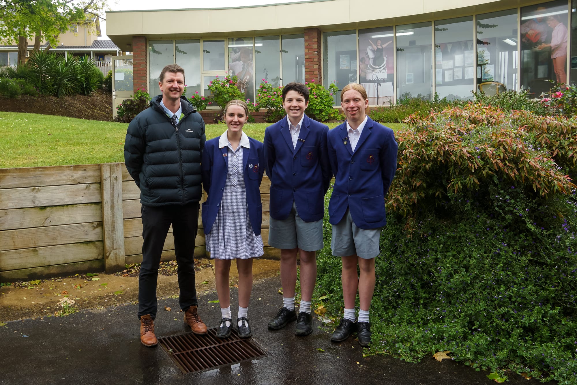 St Paul's debating coordinator Bernard Laverty with the D grade debating team winners (from left) Liv Comben, Thomas Prestidge and William Blackwood.