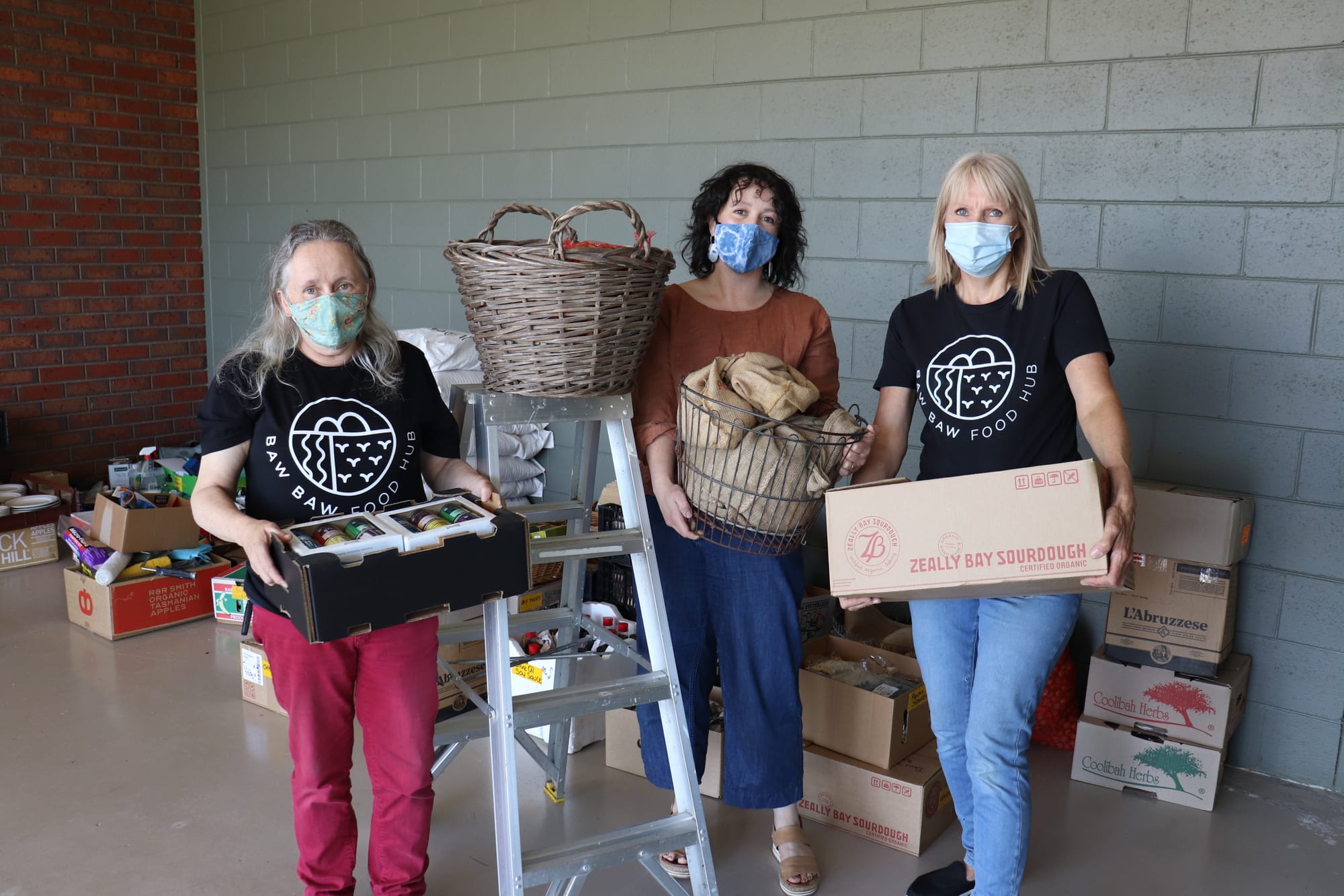 Volunteers work around the clock to help re-open food hub