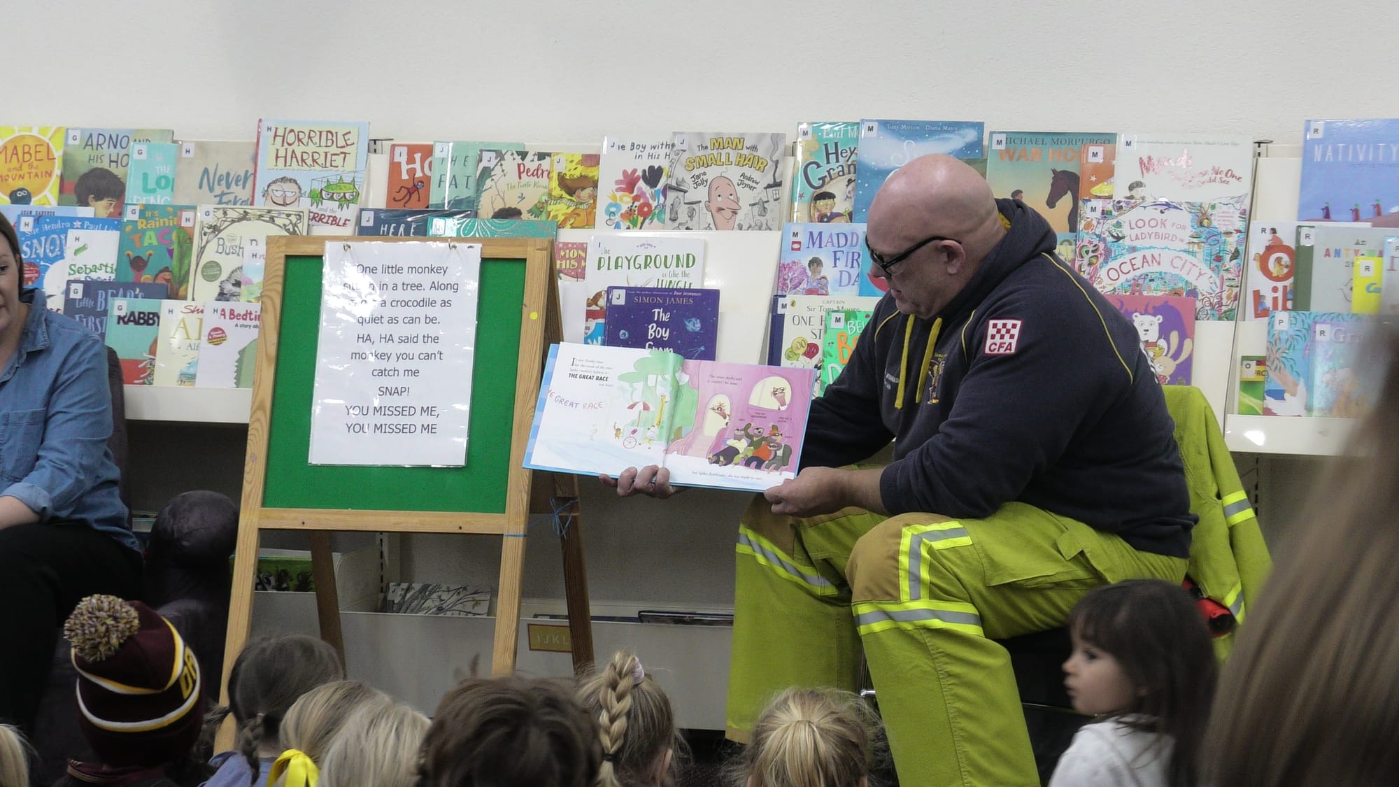 Promoting reading amongst children is Darnum Ellinbank Fire Brigade member Darren McDonald at Drouin Library.