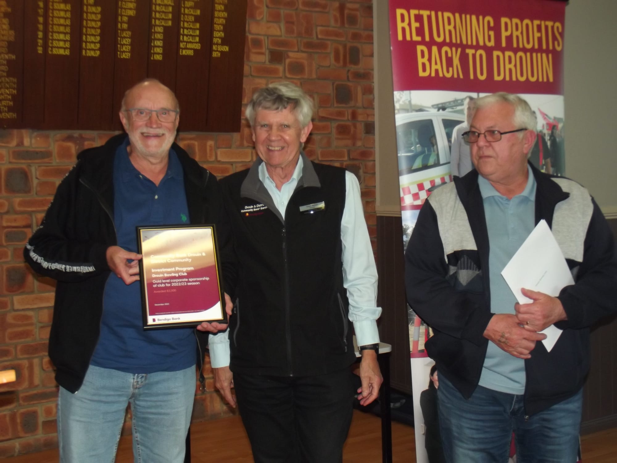 Drouin Bowling Club's Andre de Waele (left) and Russell Dawson thank community director Sean Walsh (centre) for sponsorship of the club for the 2022-2023 season.