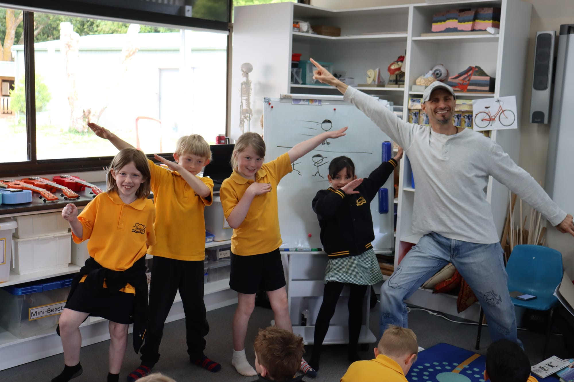 Evie, Edison, Emily, and Tanisha show off their stick figure modelling with Adam Wallace
