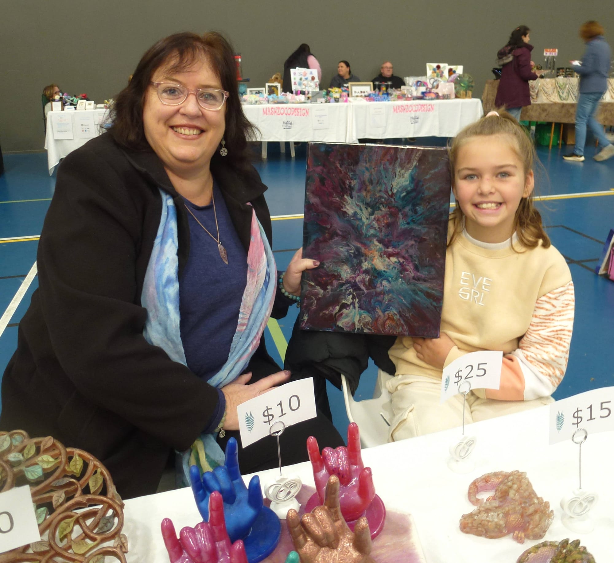Rachel Scanlon and her niece Georgie Pomeroy from Tynong show off their craft designs.