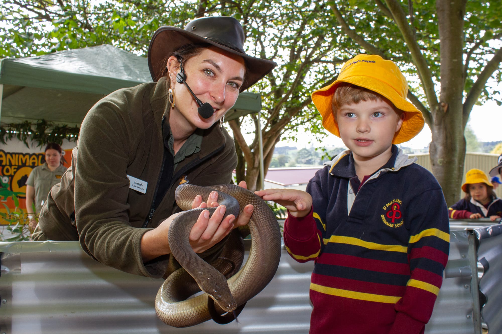 Connell McKay of Warragul got to meet Tinkerbell the Olive Python and handler Karah at Farm World.