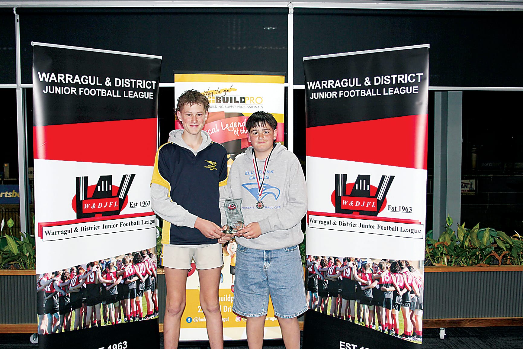 Ellinbank's Jordy Winduss and Riley Di Grandi accept the club's code of conduct award for the under 14s.