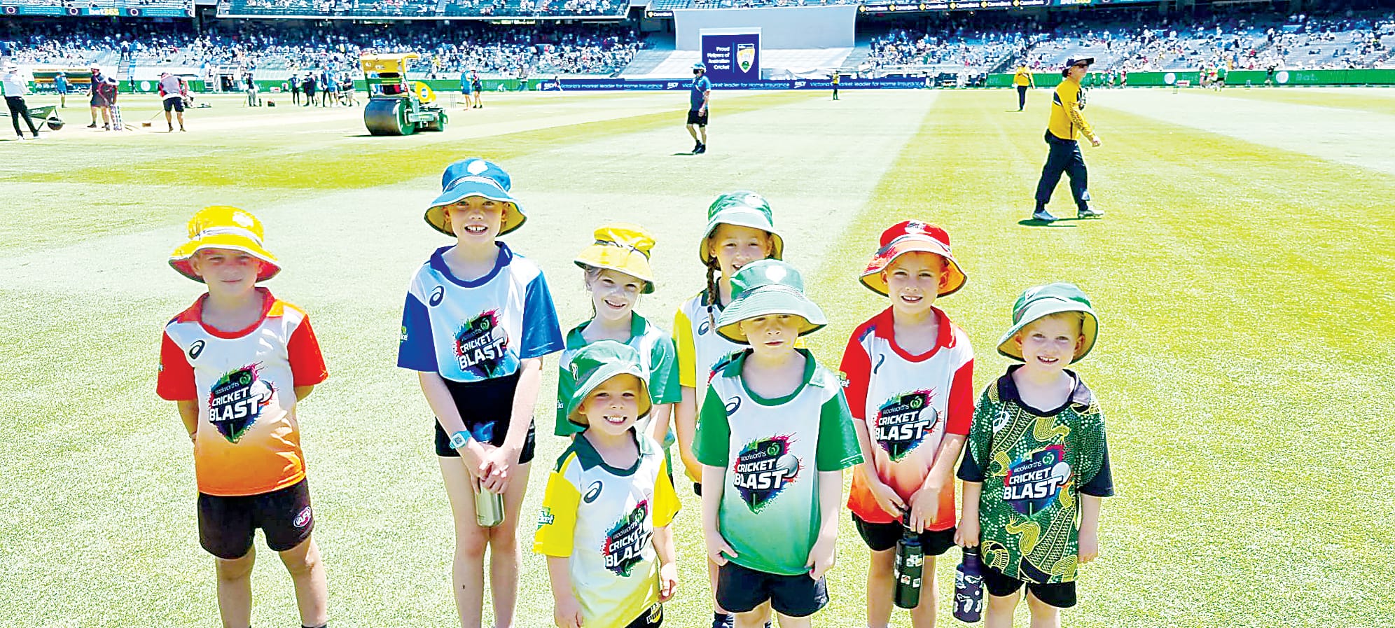 Kids run out on the MCG