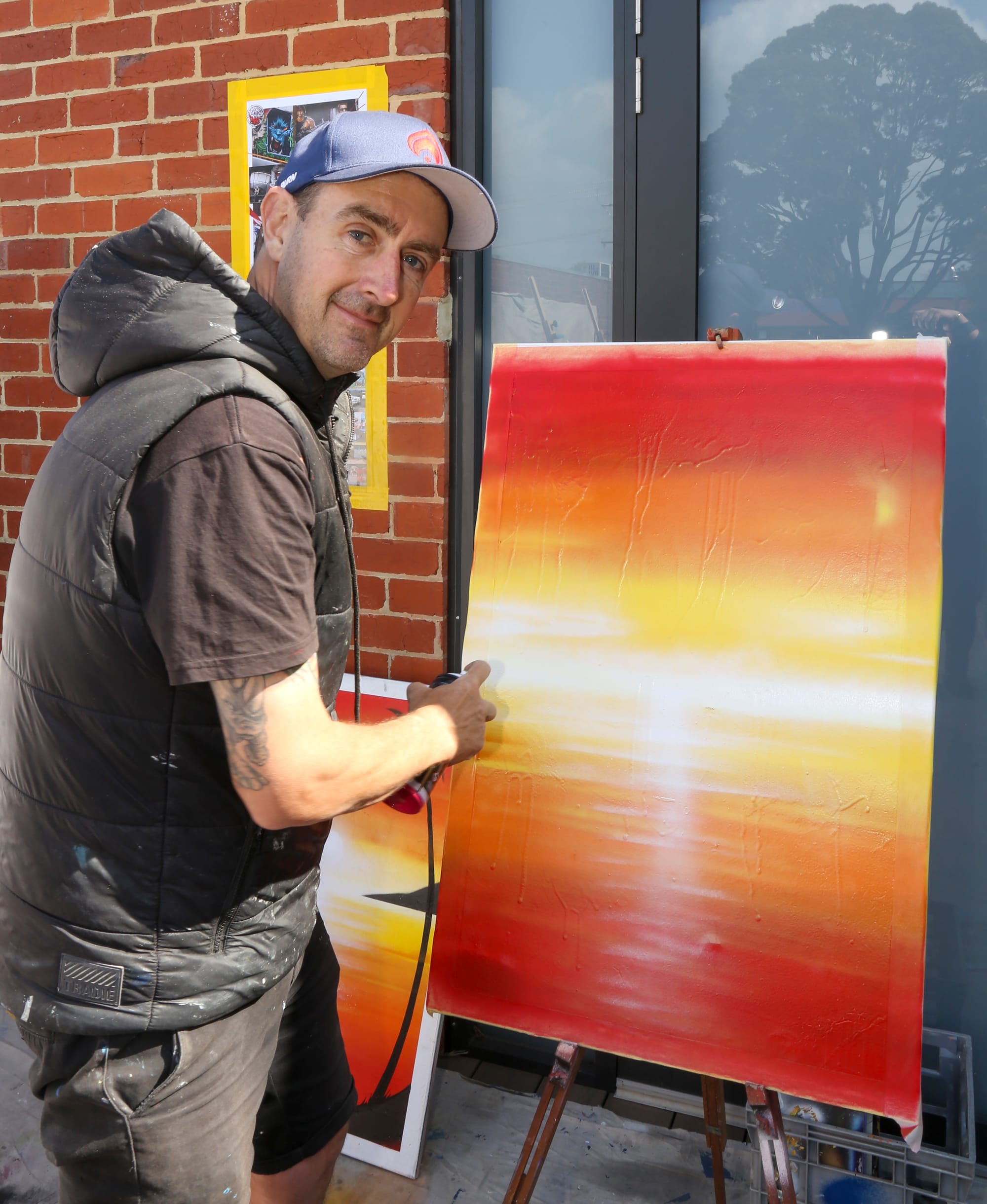 Sheldon Headspeath from State of the Art Murals leads the aerosol painting street art workshop in Drouin last week.