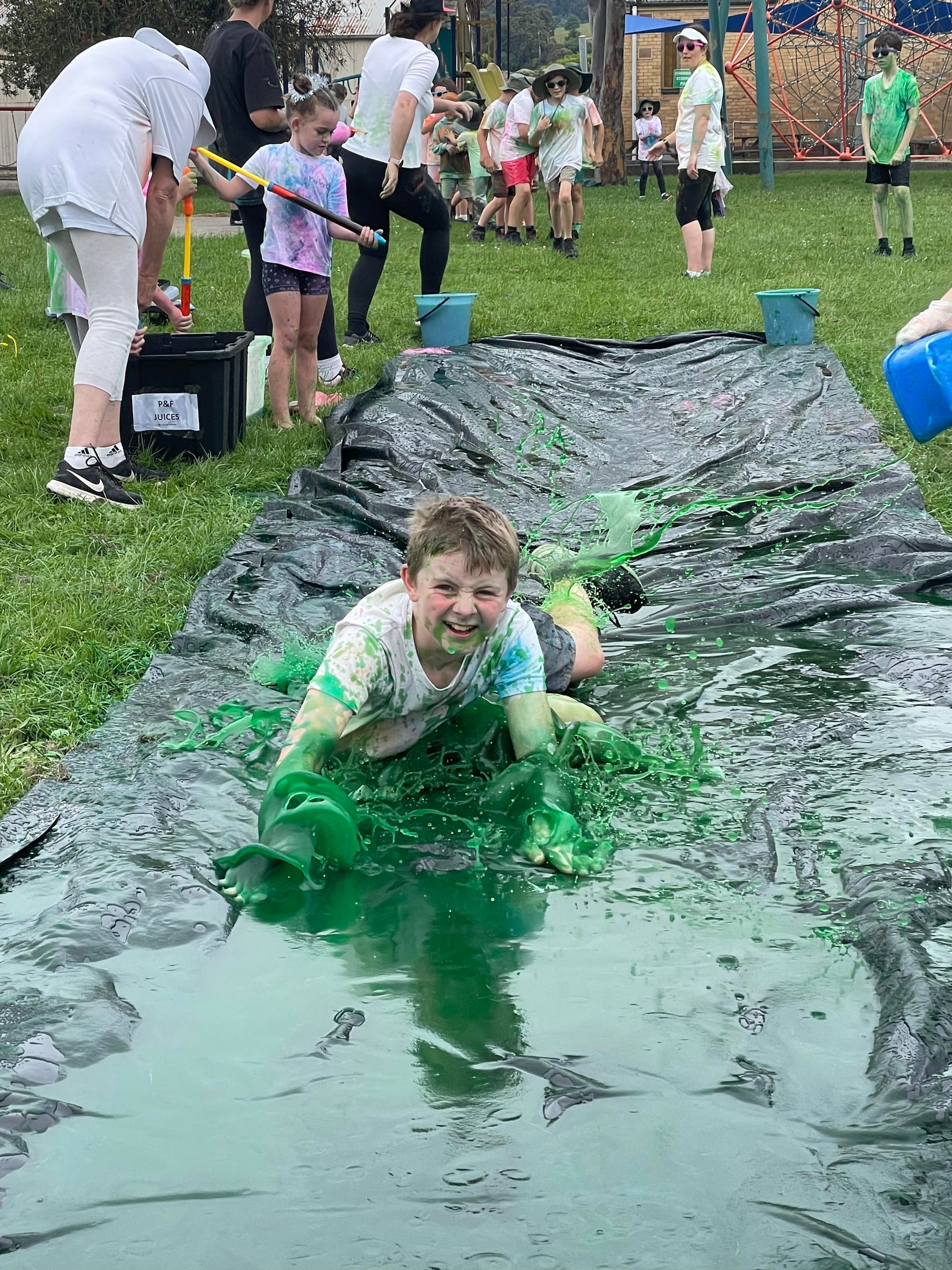 Senior student Thomas Kennedy enjoys the slime slide.