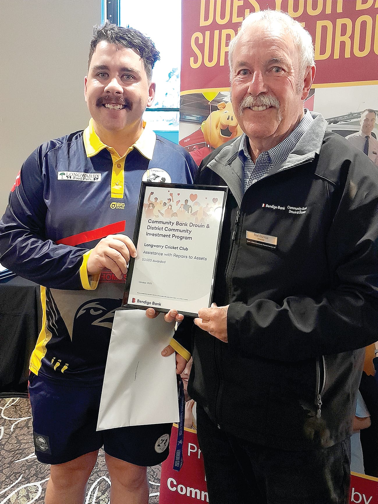 Longwarry Cricket Club's Randall Mitchell with board chair Rod Dunlop.