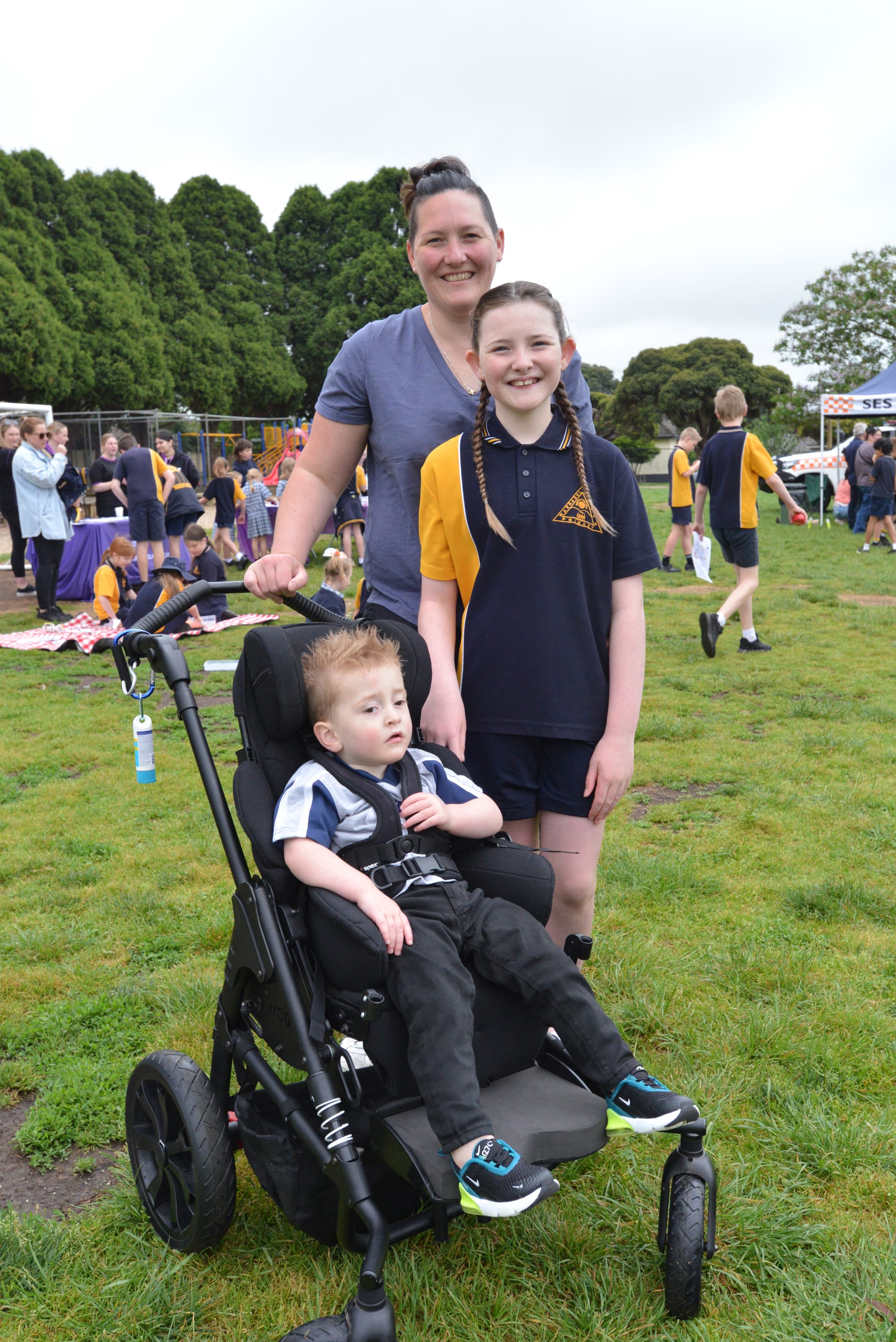 Student Aibel MacPherson takes her mum Lucy and Hudson around the Warragul North Primary School yard on Thursday.