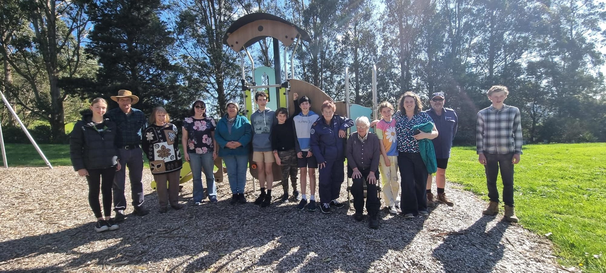 Helping out at the annual community day are (from left) Vanessa McDonald, Cameron McDonald, Jillian Amor, Jenny Mansfield, Linett McNamara, Damian McNamara, Coen Guy, Steven McNamara, Julie Ettery (CFA), Ann Bullen seated, Bronte Guy and  Lyndal Guy Turner, Peter King (CFA) and Timothy McDonald