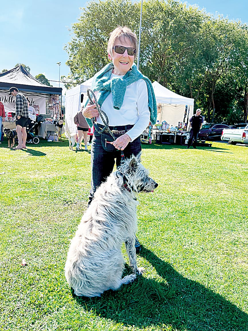 Sue Sully takes her dog Meg on a walk around the expo.