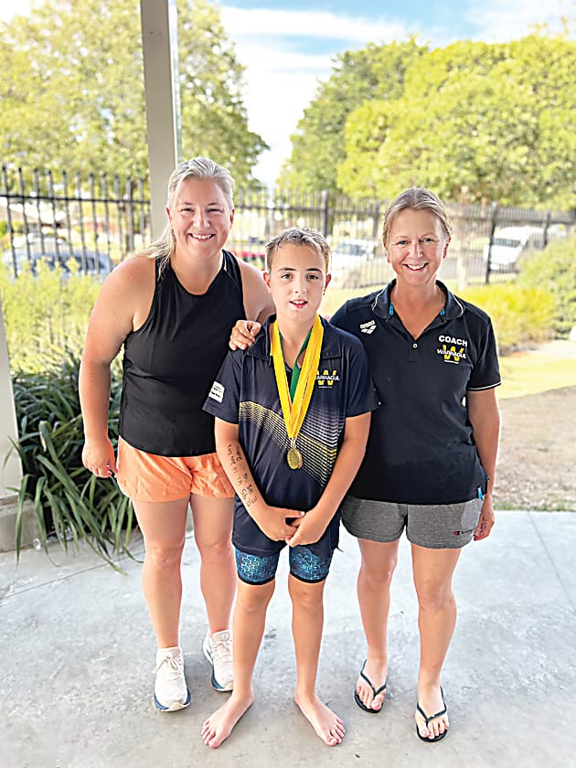 Proud coaches Michelle Chaplin (left) and Jodie Ballantyne with Logan Gibson, who achieved five individual gold medals.